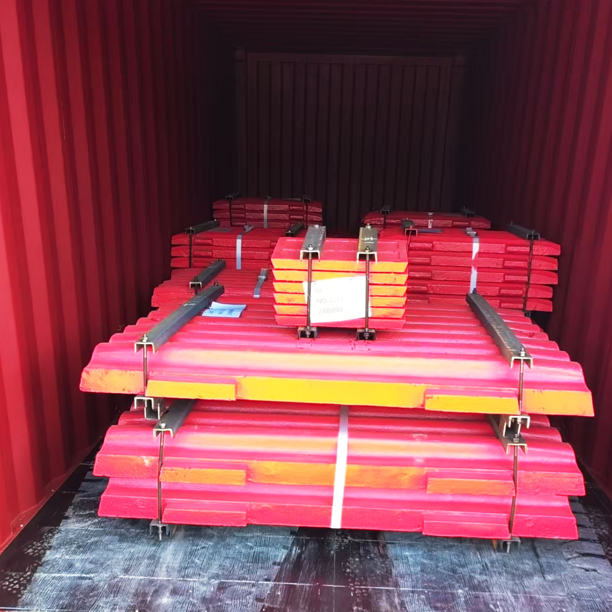 Jaw plates and check plates are loading in container for shipment overseas.